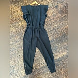 Albion 9 to 9 Jumpsuit Black Size Medium with Ruffle sleeves and Gold Ankle Zip